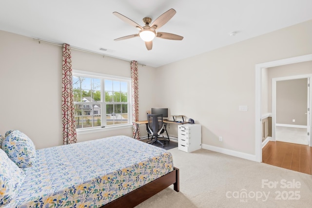 carpeted bedroom with baseboards and ceiling fan
