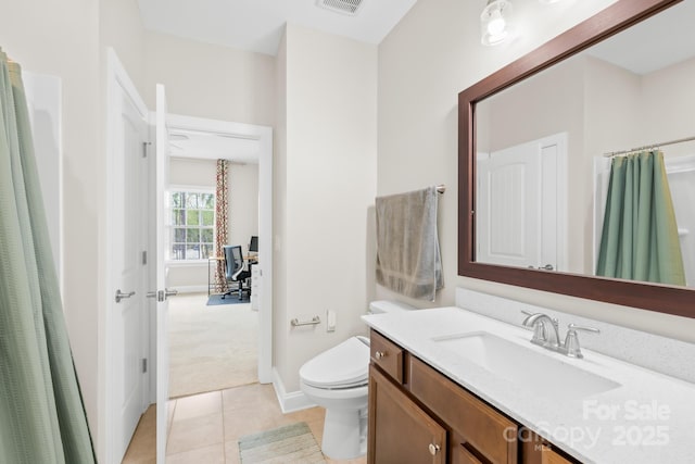bathroom featuring vanity, tile patterned flooring, visible vents, toilet, and baseboards