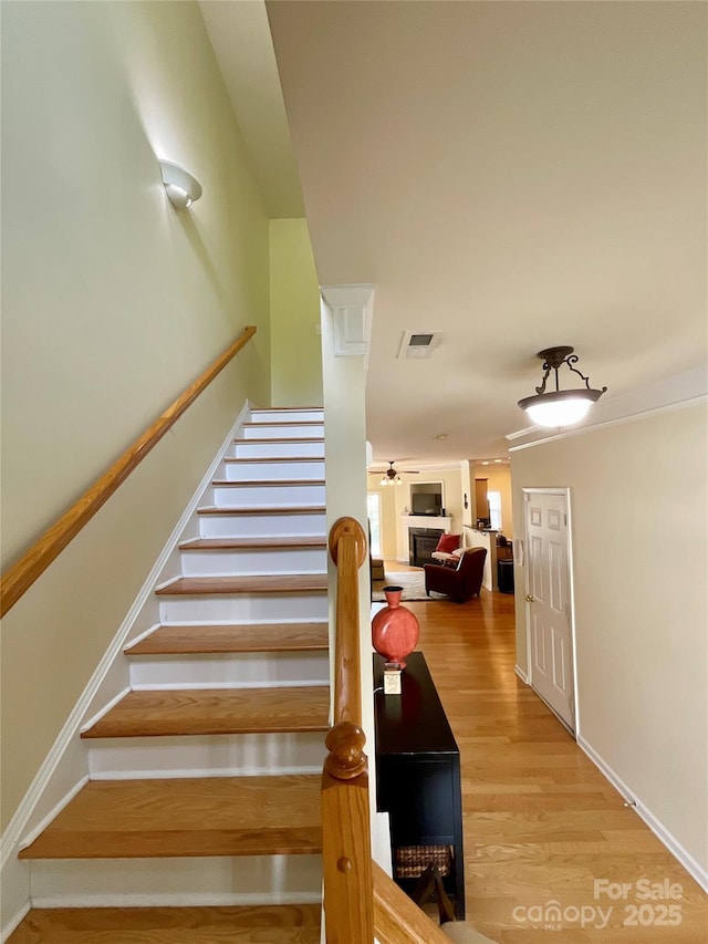 14022 Drake Watch Ln, Charlotte, NC 28262 - stairs featuring visible vents, a ceiling fan, and wood finished floors