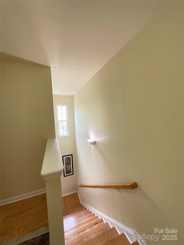 14022 Drake Watch Ln, Charlotte, NC 28262 - stairs with wood finished floors and baseboards