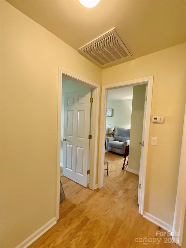 14022 Drake Watch Ln, Charlotte, NC 28262 - hall featuring light wood-style floors, visible vents, and baseboards