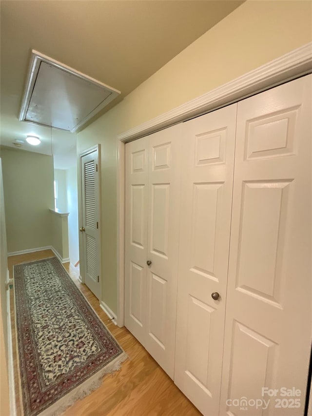 14022 Drake Watch Ln, Charlotte, NC 28262 - hall with baseboards, attic access, and light wood-style floors