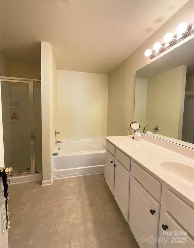 14022 Drake Watch Ln, Charlotte, NC 28262 - bathroom with a shower stall, a garden tub, vanity, and tile patterned flooring