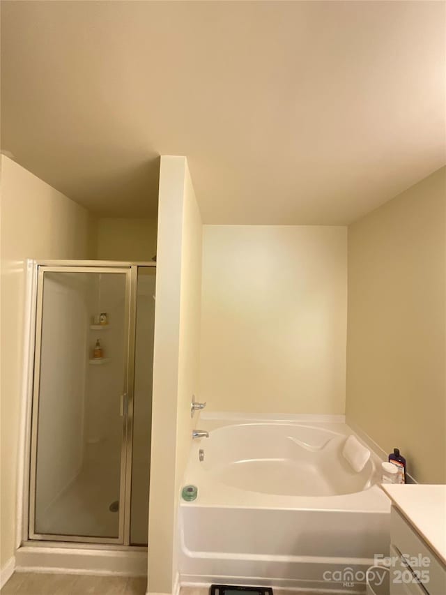 14022 Drake Watch Ln, Charlotte, NC 28262 - full bath with a shower stall, vanity, and a garden tub