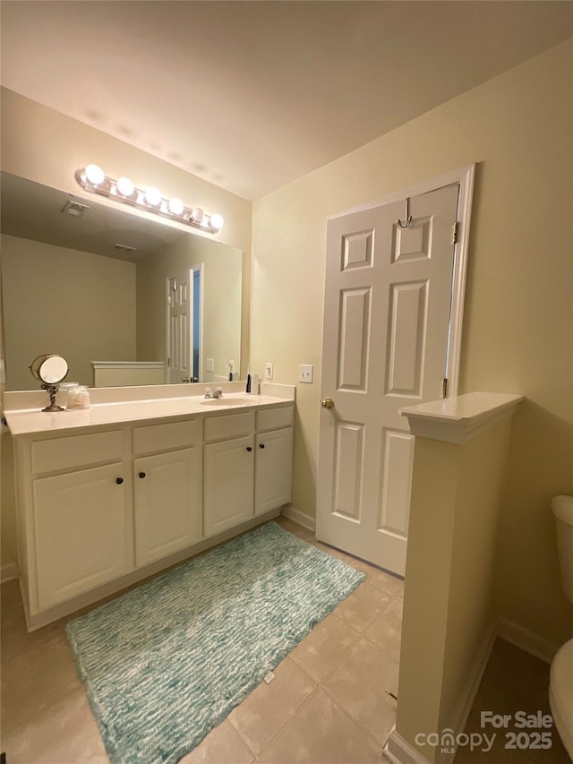 14022 Drake Watch Ln, Charlotte, NC 28262 - bathroom with vanity, baseboards, and toilet
