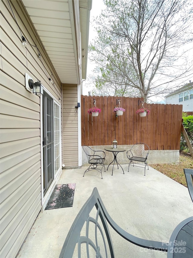 14022 Drake Watch Ln, Charlotte, NC 28262 - view of patio featuring fence