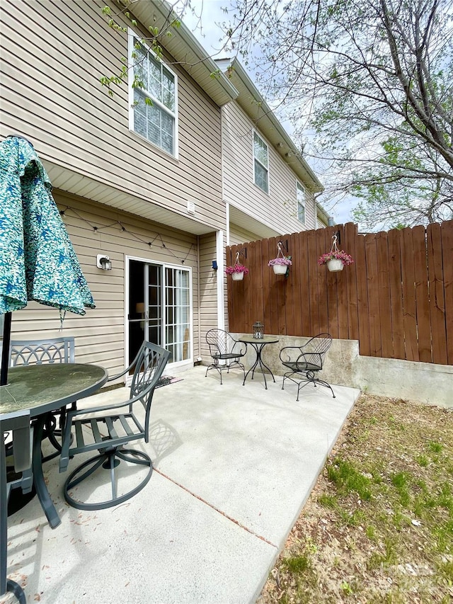 14022 Drake Watch Ln, Charlotte, NC 28262 - view of patio / terrace with outdoor dining space and fence