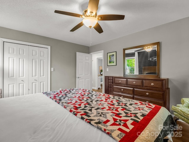 bedroom featuring a closet and ceiling fan