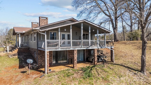 774 Belleview Rd, Franklin, NC 28734 - rear view of property featuring a chimney, a wooden deck, stairway, a yard, and a patio area