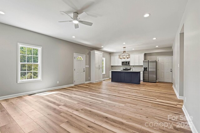 102 Kerda St, Taylorsville, NC 28681 - unfurnished living room featuring light wood-type flooring, recessed lighting, and ceiling fan