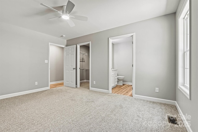 102 Kerda St, Taylorsville, NC 28681 - unfurnished bedroom featuring light carpet, baseboards, a spacious closet, a closet, and connected bathroom