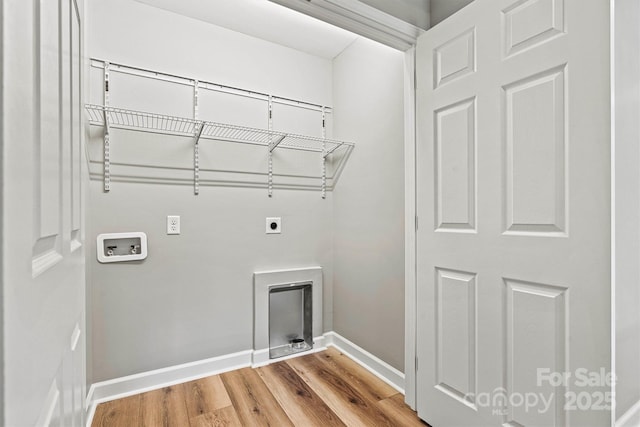 102 Kerda St, Taylorsville, NC 28681 - laundry room featuring baseboards, hookup for a washing machine, wood finished floors, electric dryer hookup, and laundry area