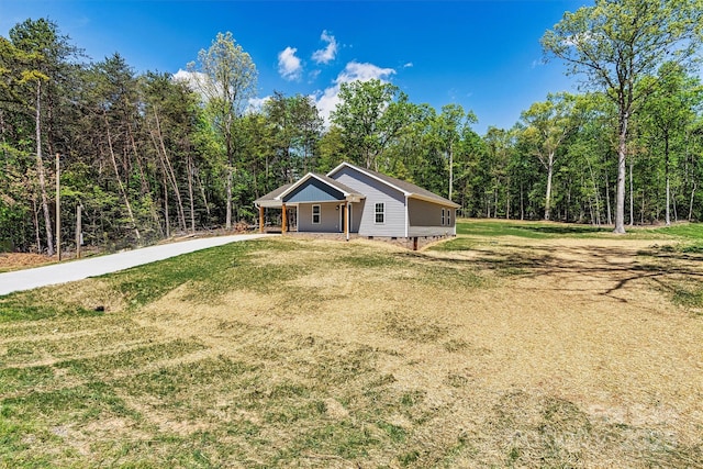 102 Kerda St, Taylorsville, NC 28681 - view of front of house with a forest view, driveway, crawl space, and a front yard