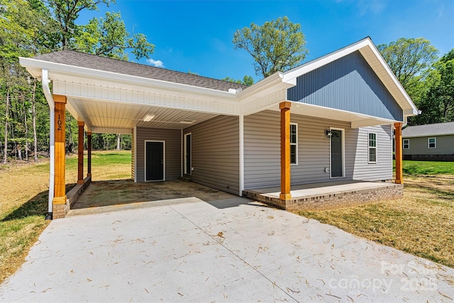 102 Kerda St, Taylorsville, NC 28681 - view of front facade with covered porch, a front yard, roof with shingles, and concrete driveway