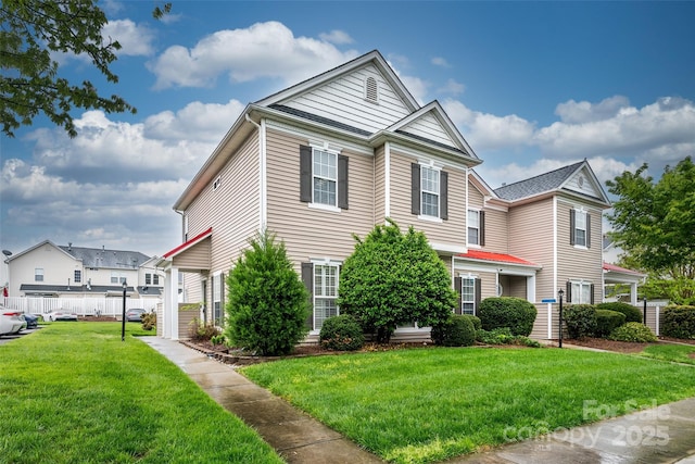 4133 Carl Parmer Dr, Harrisburg, NC 28075 - view of front of property with a front lawn and fence