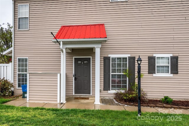 4133 Carl Parmer Dr, Harrisburg, NC 28075 - view of exterior entry with metal roof and a standing seam roof
