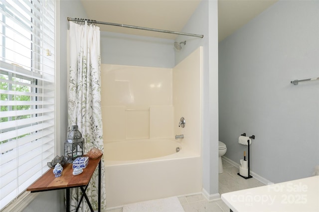 4133 Carl Parmer Dr, Harrisburg, NC 28075 - full bath with shower / bath combo, toilet, tile patterned flooring, and baseboards