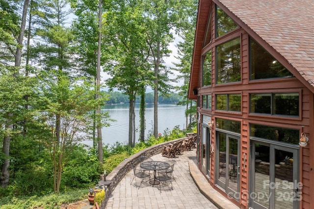 view of patio with a water view
