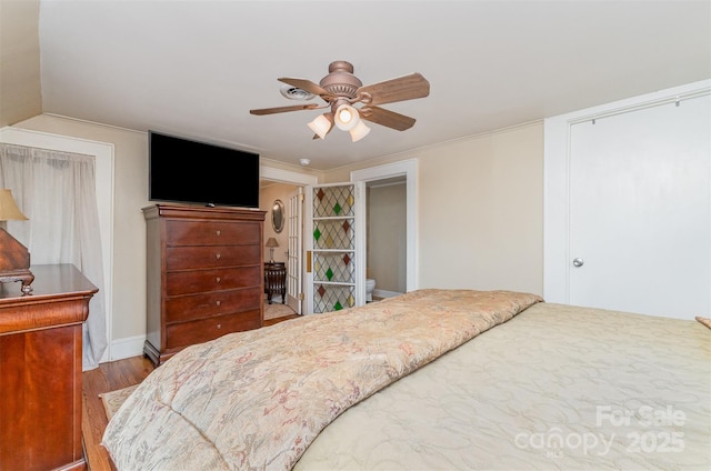 bedroom featuring ceiling fan and wood finished floors