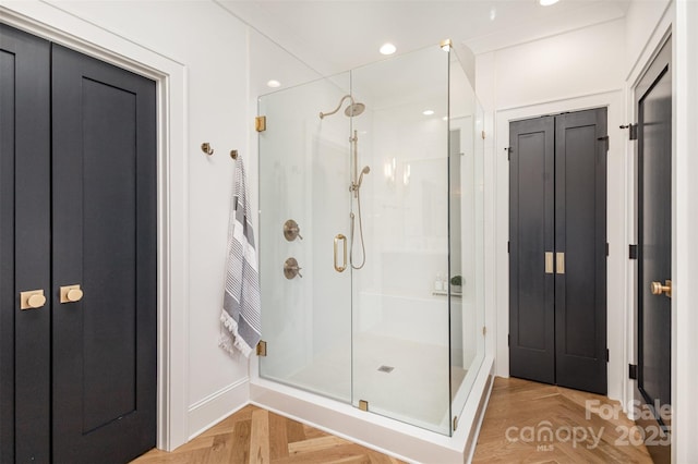 bathroom featuring a stall shower and recessed lighting