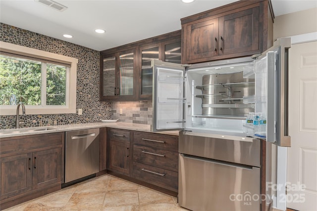 1329 Merrimon Ave, Asheville, NC 28804 - kitchen featuring a sink, visible vents, dark brown cabinetry, and stainless steel appliances