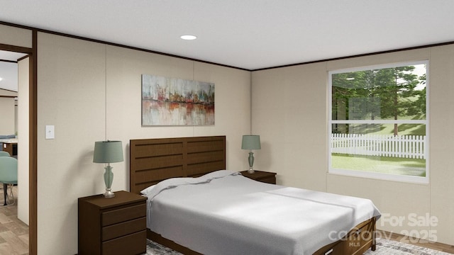 bedroom with wood finished floors and recessed lighting