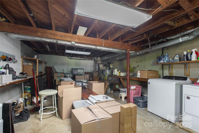 unfinished basement with washing machine and dryer