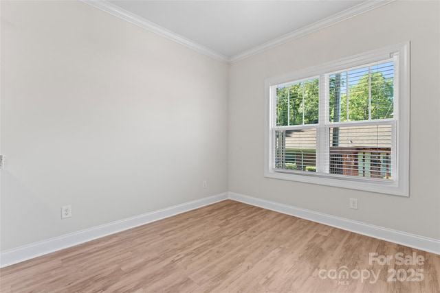 2032 Summey Ave, Charlotte, NC 28205 - spare room featuring wood finished floors, baseboards, and crown molding