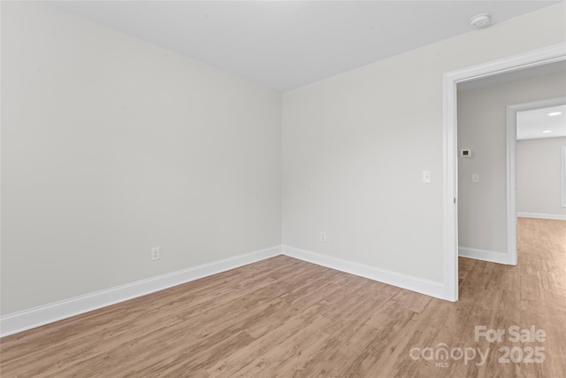 2032 Summey Ave, Charlotte, NC 28205 - unfurnished room with wood finished floors, baseboards, and a smoke detector