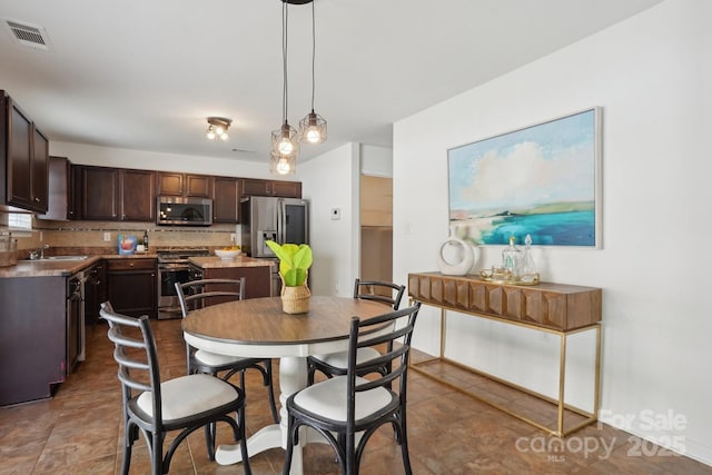 dining space featuring visible vents