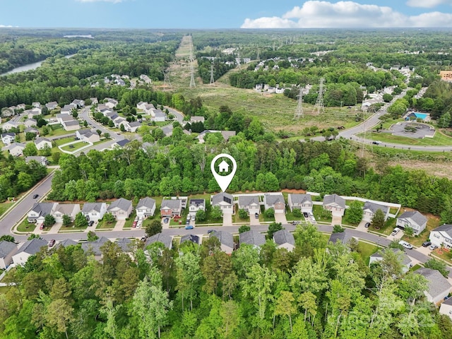 bird's eye view featuring a view of trees and a residential view