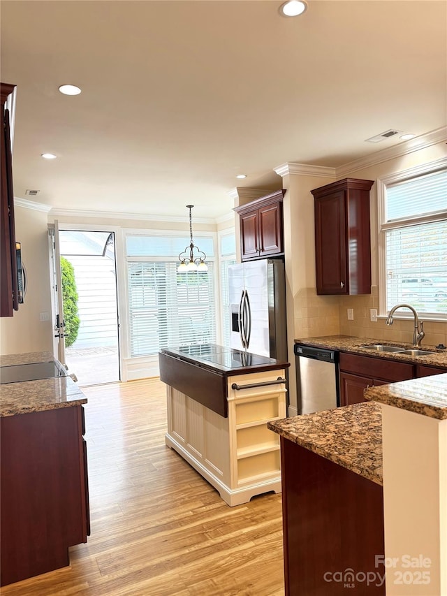 216 Harrison Ln Unit 4, Locust, NC 28097 - kitchen featuring ornamental molding, a sink, stainless steel appliances, and plenty of natural light