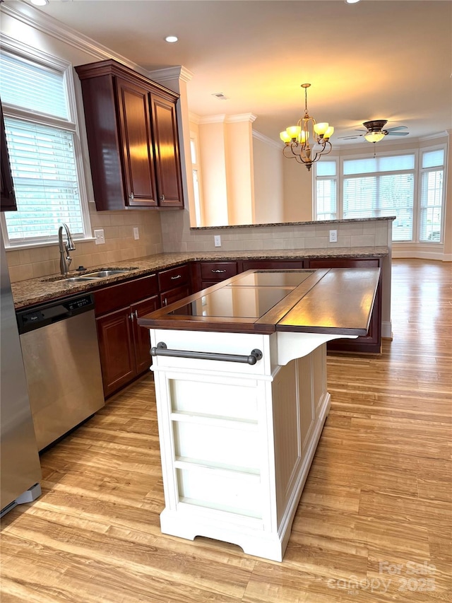 216 Harrison Ln Unit 4, Locust, NC 28097 - kitchen featuring a sink, crown molding, dishwasher, and light wood-style flooring