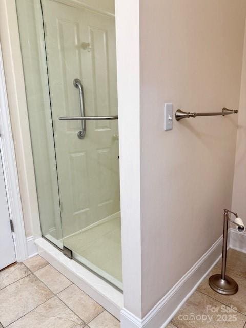 216 Harrison Ln Unit 4, Locust, NC 28097 - full bath with baseboards, a stall shower, and tile patterned flooring