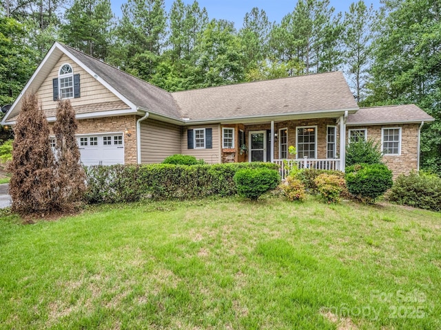 940 Hugh Champion Rd, Tryon, NC 28782 - view of front of property with a porch, a garage, stone siding, and a front lawn