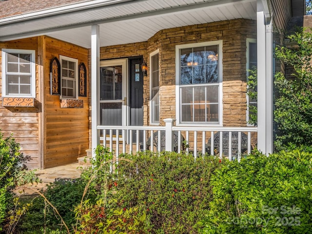 940 Hugh Champion Rd, Tryon, NC 28782 - property entrance with stone siding and covered porch