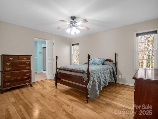 940 Hugh Champion Rd, Tryon, NC 28782 - bedroom with light wood finished floors, baseboards, and a ceiling fan