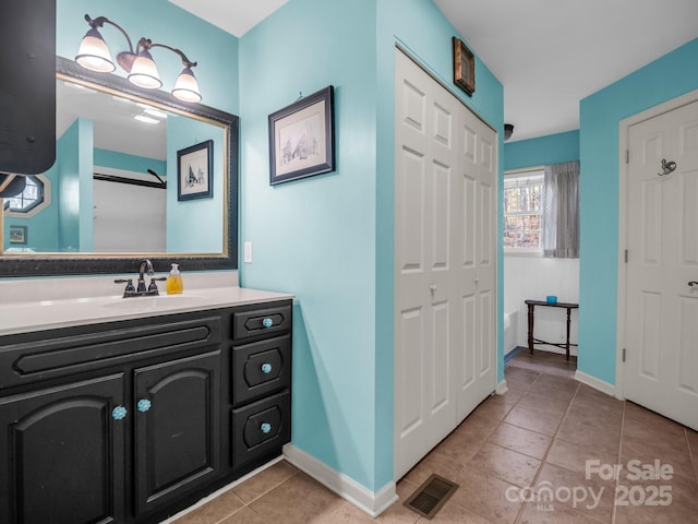 940 Hugh Champion Rd, Tryon, NC 28782 - full bath with visible vents, baseboards, tile patterned flooring, and vanity