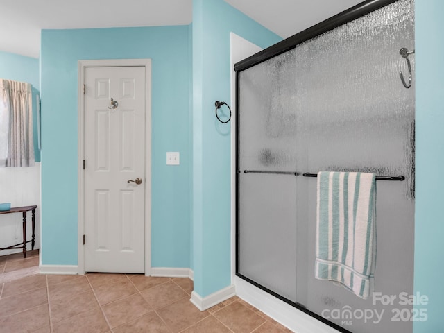 940 Hugh Champion Rd, Tryon, NC 28782 - full bathroom with a shower stall, tile patterned floors, and baseboards
