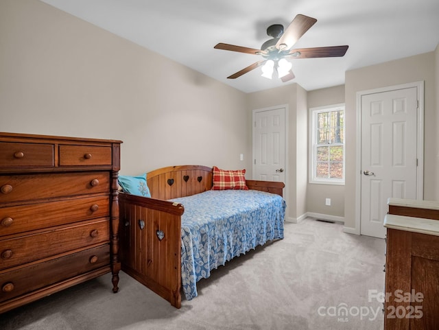 940 Hugh Champion Rd, Tryon, NC 28782 - bedroom with light colored carpet, baseboards, a ceiling fan, and visible vents