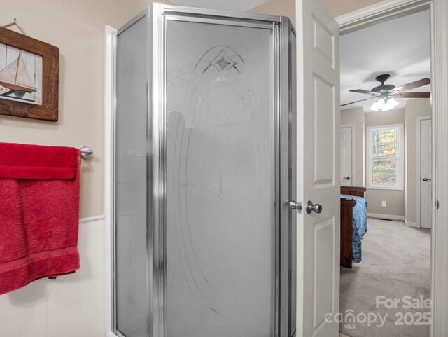 940 Hugh Champion Rd, Tryon, NC 28782 - ensuite bathroom with a shower stall, ensuite bath, baseboards, and ceiling fan