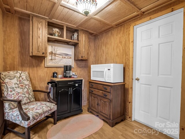 940 Hugh Champion Rd, Tryon, NC 28782 - living area featuring wood walls, light wood-type flooring, and wood ceiling