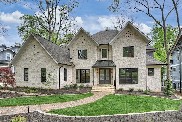 438 Wonderwood Dr, Charlotte, NC 28211 - view of front of house featuring brick siding, a front yard, and a shingled roof