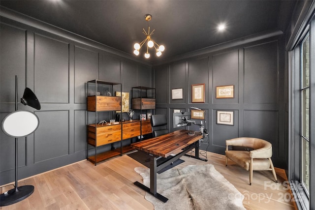 438 Wonderwood Dr, Charlotte, NC 28211 - office space featuring a decorative wall, light wood finished floors, and an inviting chandelier