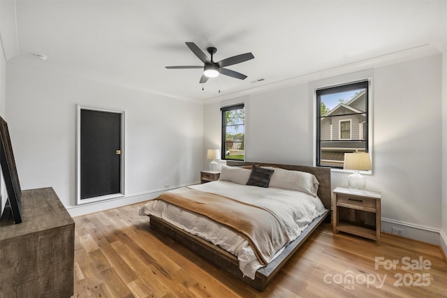 438 Wonderwood Dr, Charlotte, NC 28211 - bedroom featuring crown molding, a ceiling fan, visible vents, wood finished floors, and baseboards