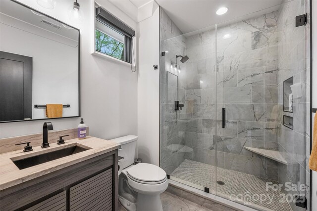 438 Wonderwood Dr, Charlotte, NC 28211 - bathroom with vanity, visible vents, recessed lighting, toilet, and a stall shower