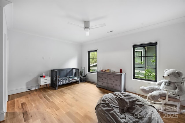 438 Wonderwood Dr, Charlotte, NC 28211 - bedroom featuring light wood-style flooring, baseboards, visible vents, and a ceiling fan