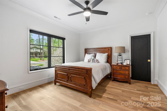 438 Wonderwood Dr, Charlotte, NC 28211 - bedroom with baseboards, visible vents, light wood-type flooring, and a ceiling fan