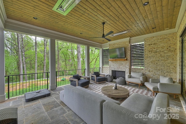 438 Wonderwood Dr, Charlotte, NC 28211 - sunroom / solarium featuring an outdoor living space with a fireplace and a ceiling fan