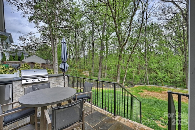 438 Wonderwood Dr, Charlotte, NC 28211 - view of patio with a grill, an outdoor kitchen, fence, and outdoor dining area